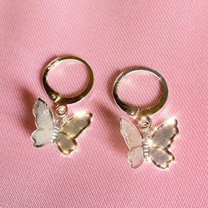 Silver butterfly huggie earrings